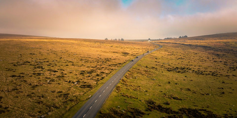Scenic country road through Dartmoor National Park, south west England- UK