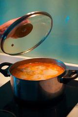 Cooking soup in a pan on an induction stove