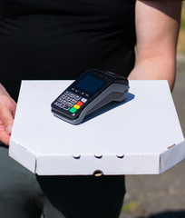 Contactless payment on delivery, guy on pizza delivery