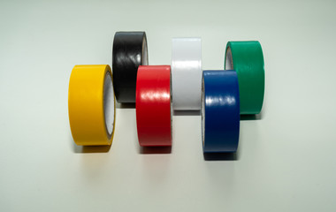 multi-colored electrical tape: blue, red, black, yellow, white, green.