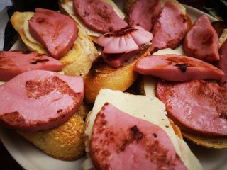 Fried sausage sandwiches. Appetizing sandwiches.