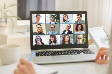 Online conference of colleagues through a laptop monitor. Video call for training. Educational webinar chat between different people. - 344928549