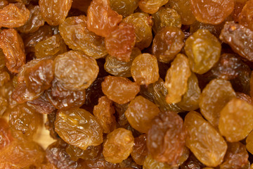 sultana raisins background close up. On wooden background