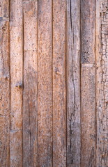 Brown texture made of old, cracked wooden planks 