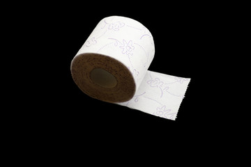 Tissue paper roll for bathroom. Soft Toilet paper isolated on black background. Bathroom hygiene concept