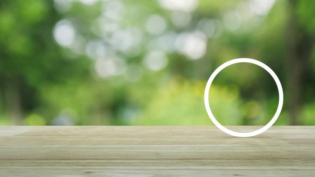 cctv camera flat icon on wooden table over blur green tree in park, Business security and safety online concept