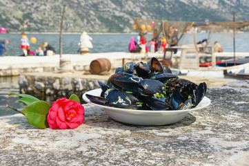  Local holidays of Montenegro. Camellia festival in Stoliv town. Camellia flower and  dish with...