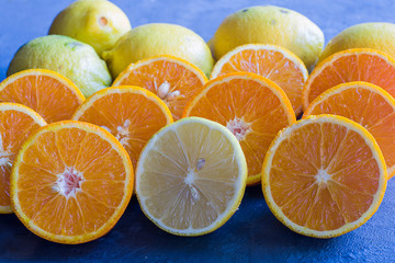 Some orange cut in middle and a half lemon