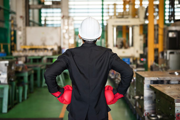 Factory businessman with gloves fight. covid-19