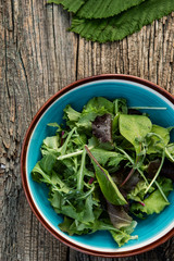 green salad on a wooden table