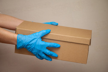 Handing over the parcel, boxes, gloves