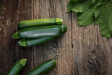 fresh zucchini on a wooden table