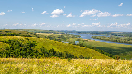 Fototapeta premium beautiful hills on the high bank of the river Vyatka on a sunny day in summer