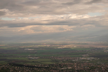 The capital of Bulgaria poured with rays of light in the early mourning. Almost aerial view of the city from the surroundings of Vitosha mountain.