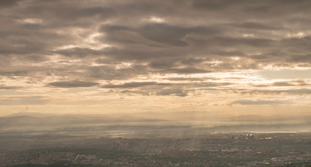 The capital of Bulgaria poured with rays of light in the early mourning. Almost aerial view of the city from the surroundings of Vitosha mountain.