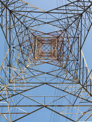POV shot of a Transmission Tower with high voltage current for Non-renewable energy concept.