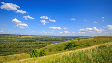 beautiful hills on the high bank of the river Vyatka on a sunny day in summer