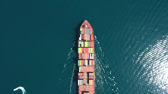 Aerial view of Cargo ship. Large container ship at sea - Aerial top down. 