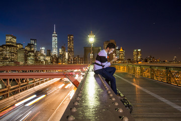 New York City - sunset over Manhattan from Brooklyn Bridge.