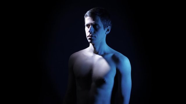 Man spinning on black background