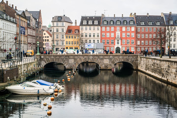 colorful town of Copenhagen Denmark and reflection of bridge 