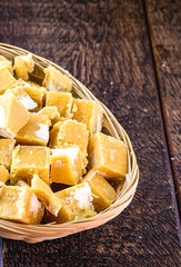 typical cane and molasses candy, made in brazil and latin america, inside a straw basket, typical latin american cuisine. Sweets typical of the June and July festivals.