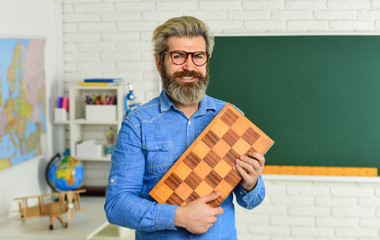 Management and leadership. Board game. Smart man playing chess. Intellectual hobby. Chess lesson....