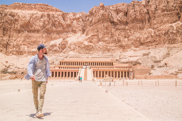 traveler walking toward temple of Hatshepsut in Egypt