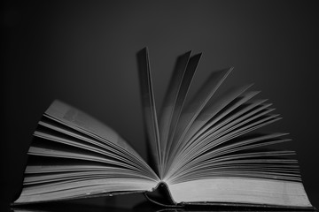 open book on black background