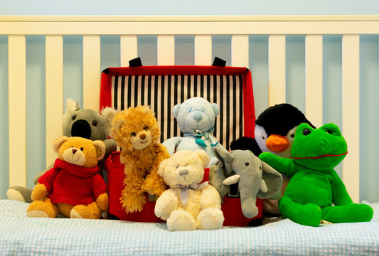 Best friends. Group of fluffly toys on a cot 