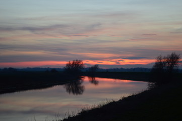 Fototapeta na wymiar Reflection of sunset