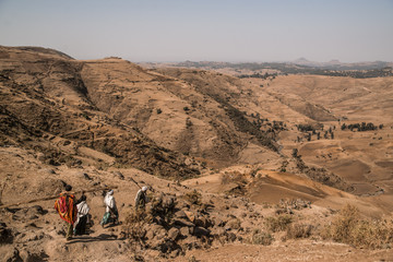 nomads hiking through mountains of Ethiopia