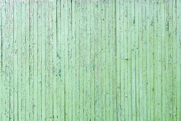 Fototapeta na wymiar Old green wooden fence. Wall textured background.