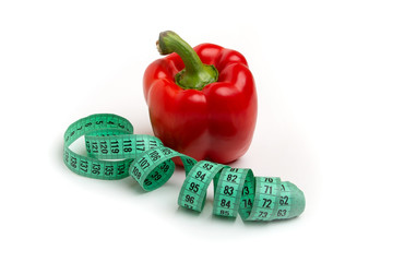 bright red peppers and  with Measuring tape white background