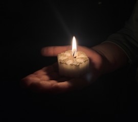 hand with candle