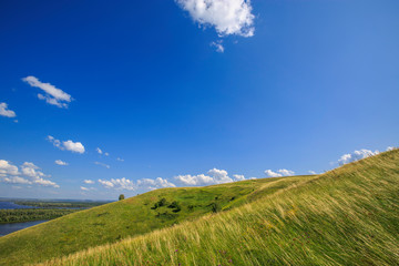 beautiful hills on the high bank of the river Vyatka on a sunny day in summer