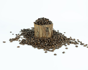Coffee beans lying on small stump and around