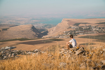Traveler overlooking the sea of Galilee