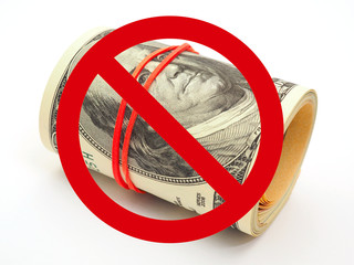 Prohibition sign on 100 dollar bills. Notes are rolled up, pulled together with an elastic band and...