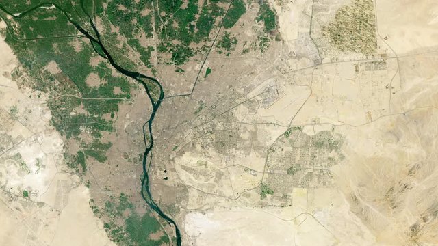 Urban sprawl of a city during years time lapse satellite aerial view, Cairo Egypt Nile river. Images furnished by Nasa