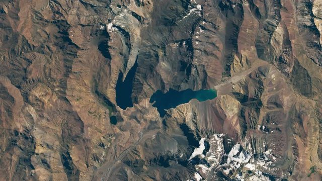 Artificial lake water supply reduction time lapse due to drought at El Yeso dam, Chile, satellite aerial view animation. Images furnished by Nasa