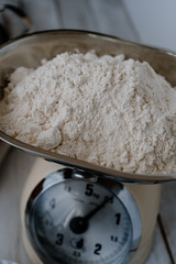 Wheat flour in a traditional balance weight