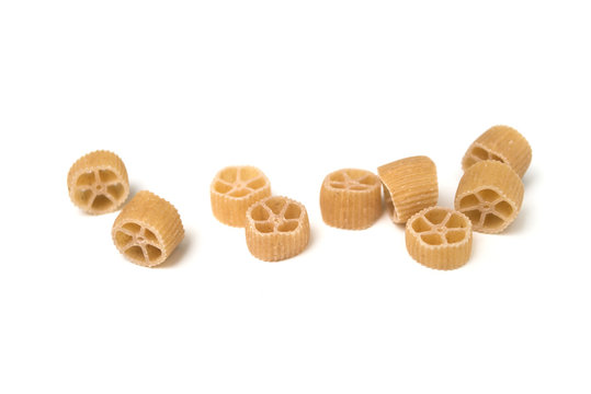  Closeup of gluten free pasta in shaped wheel on top view on white background