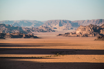 Fototapeta na wymiar Shadows through red rock desert wadi rum