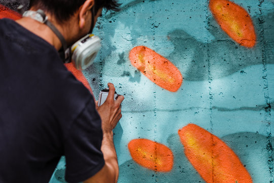 Graffiti artist painting