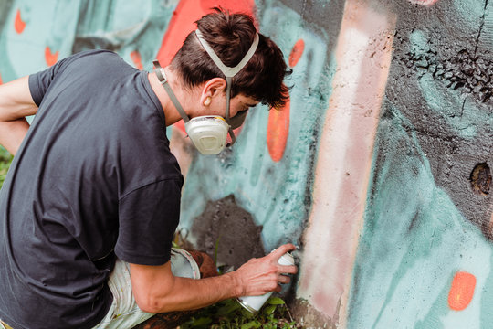 Graffiti artist painting