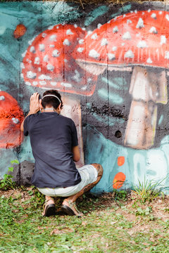 Graffiti artist painting