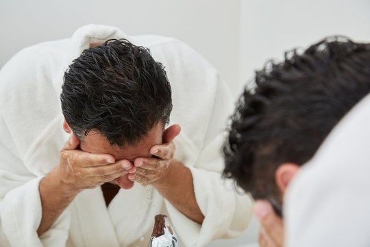 Man Washing Face