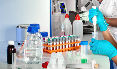 Testing facility. Young African female scientists or medical students, positive young professional...