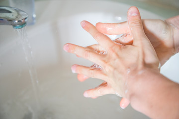 Washing hands rubbing with soap man for corona virus prevention, hygiene to stop spreading coronavirus.